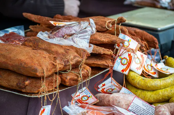 stock image JUZCAR, SPAIN - APRIL 28 2024: Delicates on local market in Juzcar, Spain on April 28, 2024