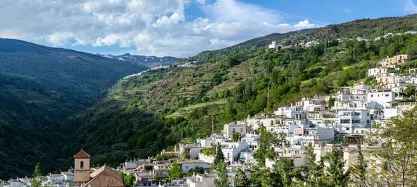 stock image SIERRA NEVADA, SPAIN - MAY 11, 2024: Typical Spanish village in   Sierra Nevada National Park, Spain on May 11, 2024