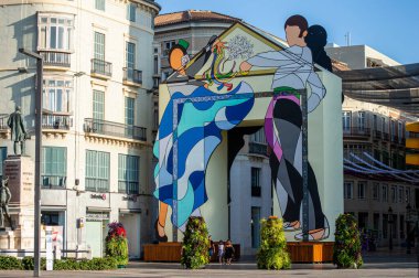 MALAGA, SPAIN - AUGUST 13, 2023: The gate of the Feria in the beginning of Larios street in Malaga, Spain on August 13, 2023 clipart