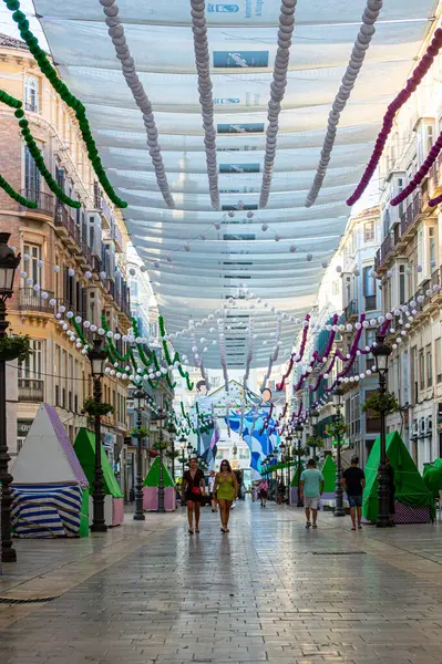 stock image MALAGA, SPAIN - AUGUST 13, 2023: The gate of the Feria in the beginning of Larios street in Malaga, Spain on August 13, 2023