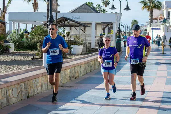 stock image TORREMOLINOS, SPAIN - FEBRUARY 4, 2024: Runners on half Marathon de Torremolinos in Torremolinos, Spain on February 4, 2024