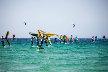 TARIFA, SPAIN - MAY 25, 2024: Enjoying kitesurfing on Valdevaqueros beach, Gibraltar Strait in Tarifa, Spain on May 25, 2024 clipart