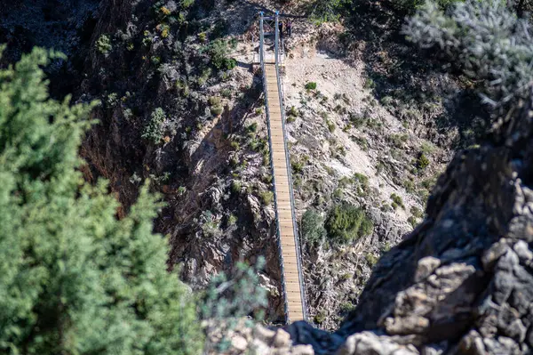 stock image Hiking trail to Colgante bridge (Puente Colgante El Saltillo) over Almanchares river, Sierra Tejeda, Andalusia, Spain