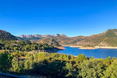 Sunset over water reservoir, Embalse de los Barrios de Luna, Oviedo, Asturia clipart