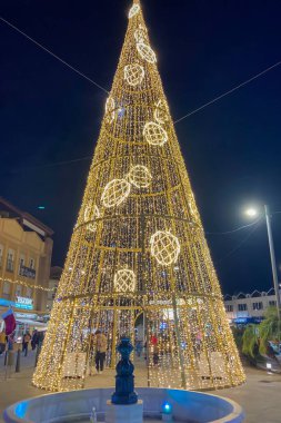 BENALMADENA, SPAIN - DECEMBER 14, 2024: Benalmadena sparkles with festive Christmas lights and decorations, creating a magical holiday atmosphere clipart