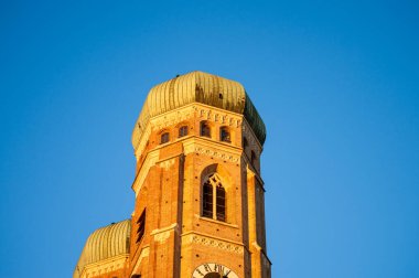 MUNICH, GERMANY - DECEMBER 1, 2024: The Frauenkirche church serves as the cathedral of the Archdiocese in Munich, Germany on December 1, 2024 clipart