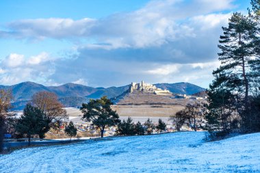 Panoramic winter view of Spis Castle in Slovakia, one of Central Europe's largest medieval castles, dates back to the 12th century. clipart