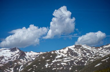 Panoramic view on snowy mountains on hiking trail to Mulhacen peak in the spring, Sierra Nevada range, Andalusia, Spain clipart