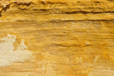 Sarı taş duvar dokusu, doğal malzemeler.