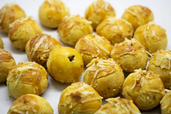 Pineapple tart is a small, bite-size tart filled or topped with pineapple jam, commonly found throughout different parts of Southeast Asia such as Indonesia