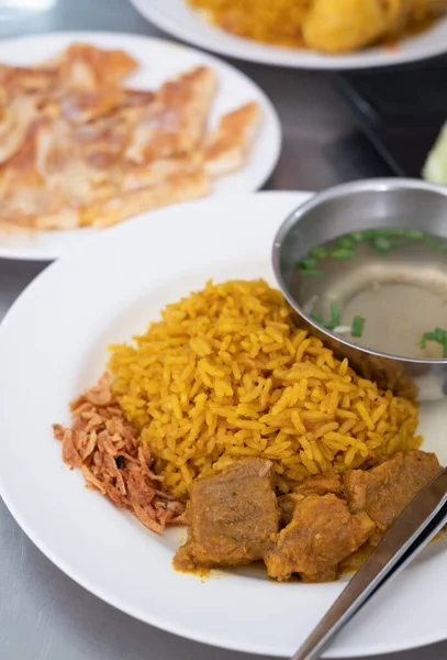 muslim yellow rice with beef and roti background,halal food in sothern of thailand