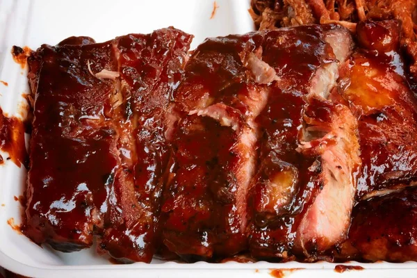 Closeup delicious smoked ribs with barbecue sauce