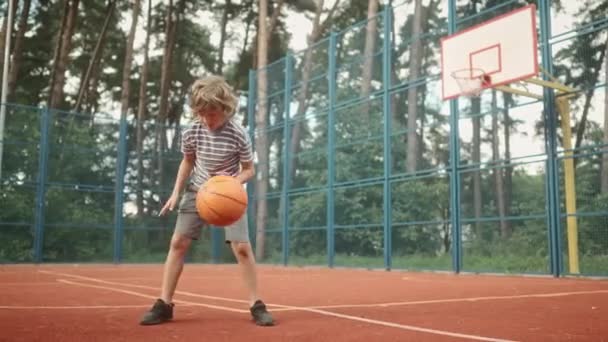 Little Boy Throwing Ball Background Basketball Court Preadolescent Child Training — Stock Video