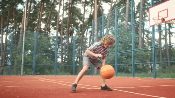 Young Boy Playing Basketball Court Little Player Leading Ball Dribbling — Stock Video