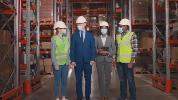Multiethnic Group Standing Warehouse Engineers Crossed Arms Background Racks Bosses — Stock Video