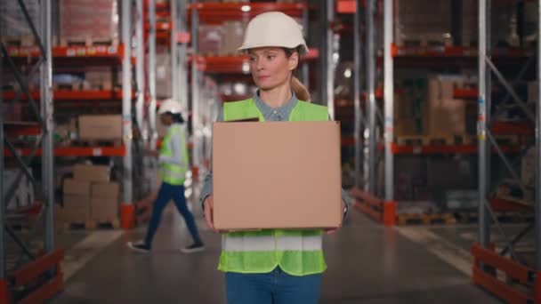 Female Storage Employee Working Warehouse Industrial Worker Carrying Box Background — Stock Video