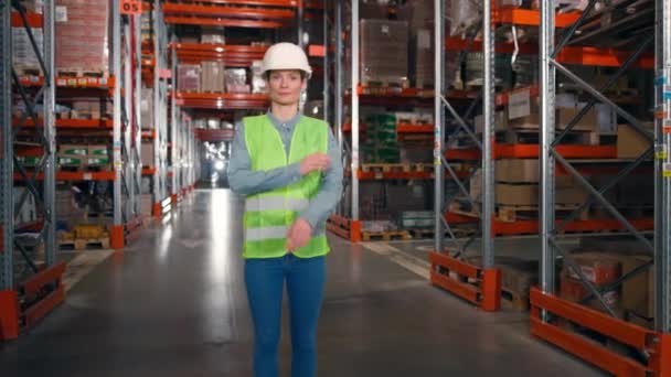Female Smiling Employee Standing Large Storage Warehouse Worker Protective Hardhat — Stock Video