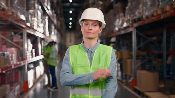 Woman Smiling Employee Standing Large Storage Warehouse Female Protective Hardhat — Stock Video