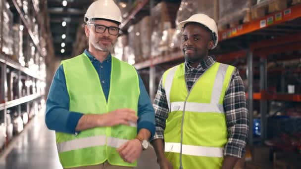 Multicultural Men Protective Uniform Looking Each Other Warehouse Two Industrial — Stock Video