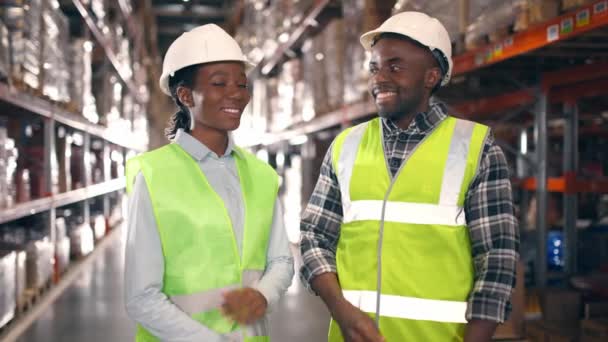 African American Woman Man Protective Uniform Looking Each Other Warehouse — Stock Video