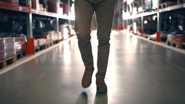 Cropped Shot Man Legs Warehouse Worker Going Storage Corridor Human — Stock Video