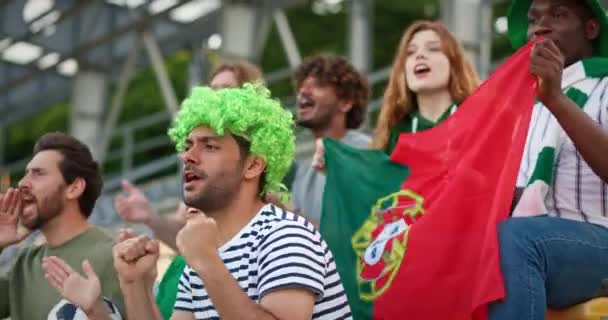 Football Fans Watching Tournament Stadium Young Multinational People Cheering Portugal — Stock Video