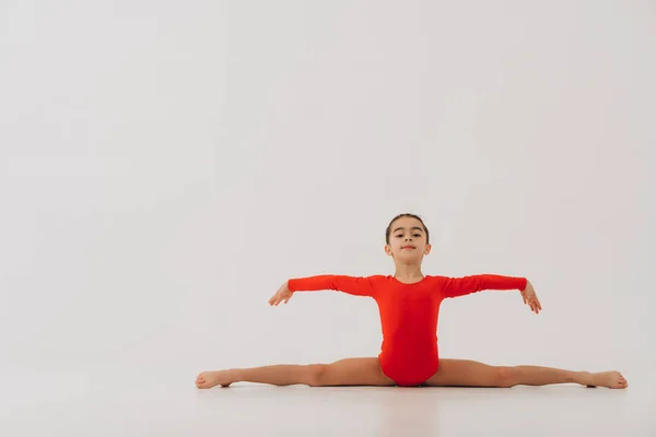 Young Girl Performs Element Gymnastics White Background — Stock Photo, Image