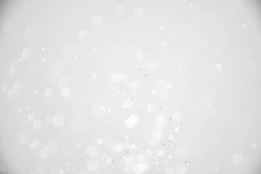 Beyaz parıltılı noel arkaplanı. soyut beyaz odaklanmış ışıklar.