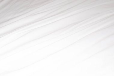 Dalgalı kıvrımlı yumuşak beyaz ipek kumaş. arkaplan.