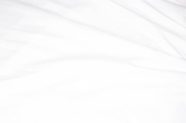 Yumuşak dalga ışığı olan soyut beyaz yumuşak kumaş dokusu