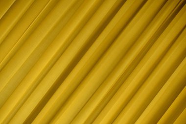 Sarı ipek kumaş. Tasarım için soyut ipek arkaplanı