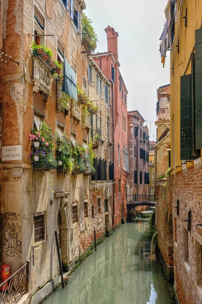 Venice, Italy - June 22, 2023: Canal, bridge and ancient houses of Venice.