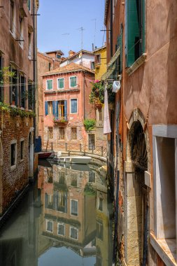 Venice, Italy - June 22, 2023: Canal, bridge and ancient houses of Venice.