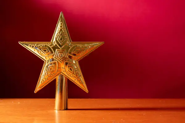 Golden Christmas Star Wooden Table Red Background — Stock Photo, Image
