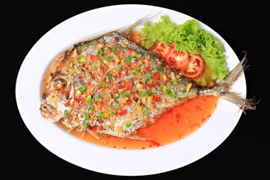 Deep-fried Diamond Trevally with Three flavored Sauce, Diamond Trevally fried fish with Three flavored Sauce. Food photography for use in menus 