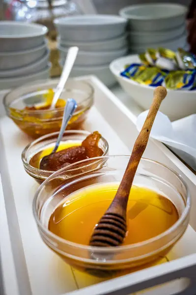 Hotel Buffet Delight: Close-Up of Sweetener Corner with Honey and Jam Bowl. Perfect for hotel promotions, culinary blogs,