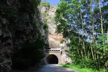 Entrance to the mountain road tunnel clipart
