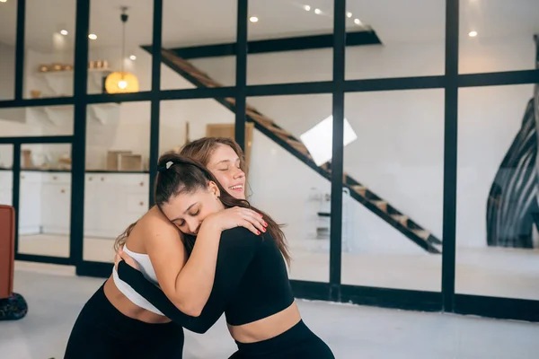 Two Girlfriends Hug Each Other Yoga Home — Foto Stock