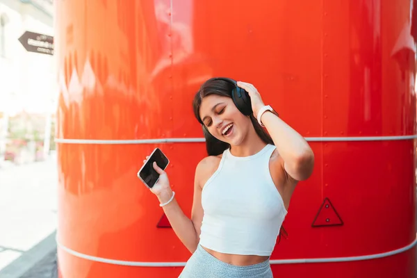Portrait Happy Girl Listening Music Online Wireless Headphones Smartphone Street — Fotografia de Stock