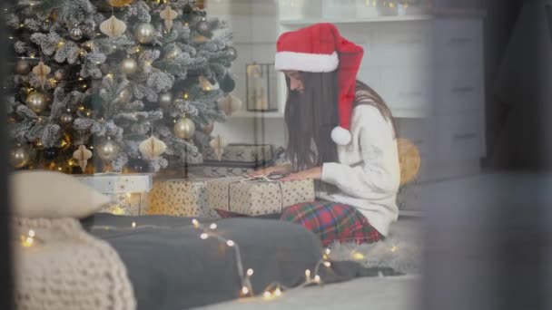 Looking Window Young Woman Holding Gift Christmas Tree — Stock Video