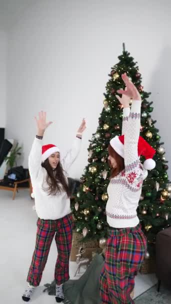 Overjoyed Crazy Young Women Having Fun Dancing Christmas Tree Decorated — Stock Video