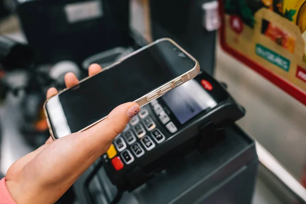 stock image making payments from pos device via mobile phone