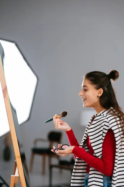 Happy Young Woman Applies Makeup Her Face Front Mirror — Stock Photo, Image