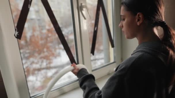 Woman Measuring Foam Tape Sealing Window Indoor — Stock Video