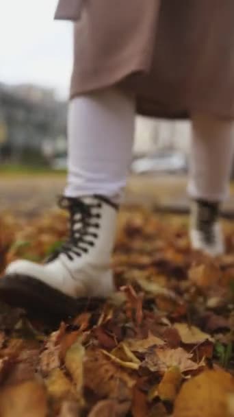 Woman Walking Street Full Dead Leaves Autumn — Stock Video