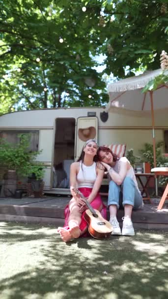 Two Beautiful Hippie Girls Sitting Trailer Guitar One Them Has — стоковое видео