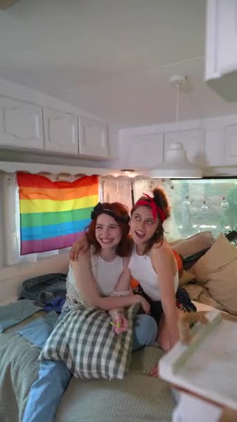 Two Beautiful Hippie Girls Laughing Hugging Bed Trailer Lgbt Flag — Αρχείο Βίντεο