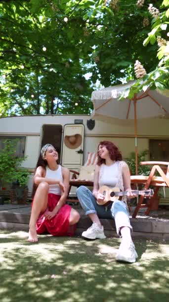 Slow Motion Two Beautiful Hippie Girls Singing Song Sitting Terrace — стоковое видео