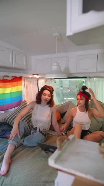 Two Cute Hippie Girls Sit Closer Each Other Bed Trailer — Stockvideo
