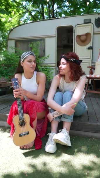 Two Beautiful Hippie Girls Talking Sitting Terrace Trailer Guitar High — Video
